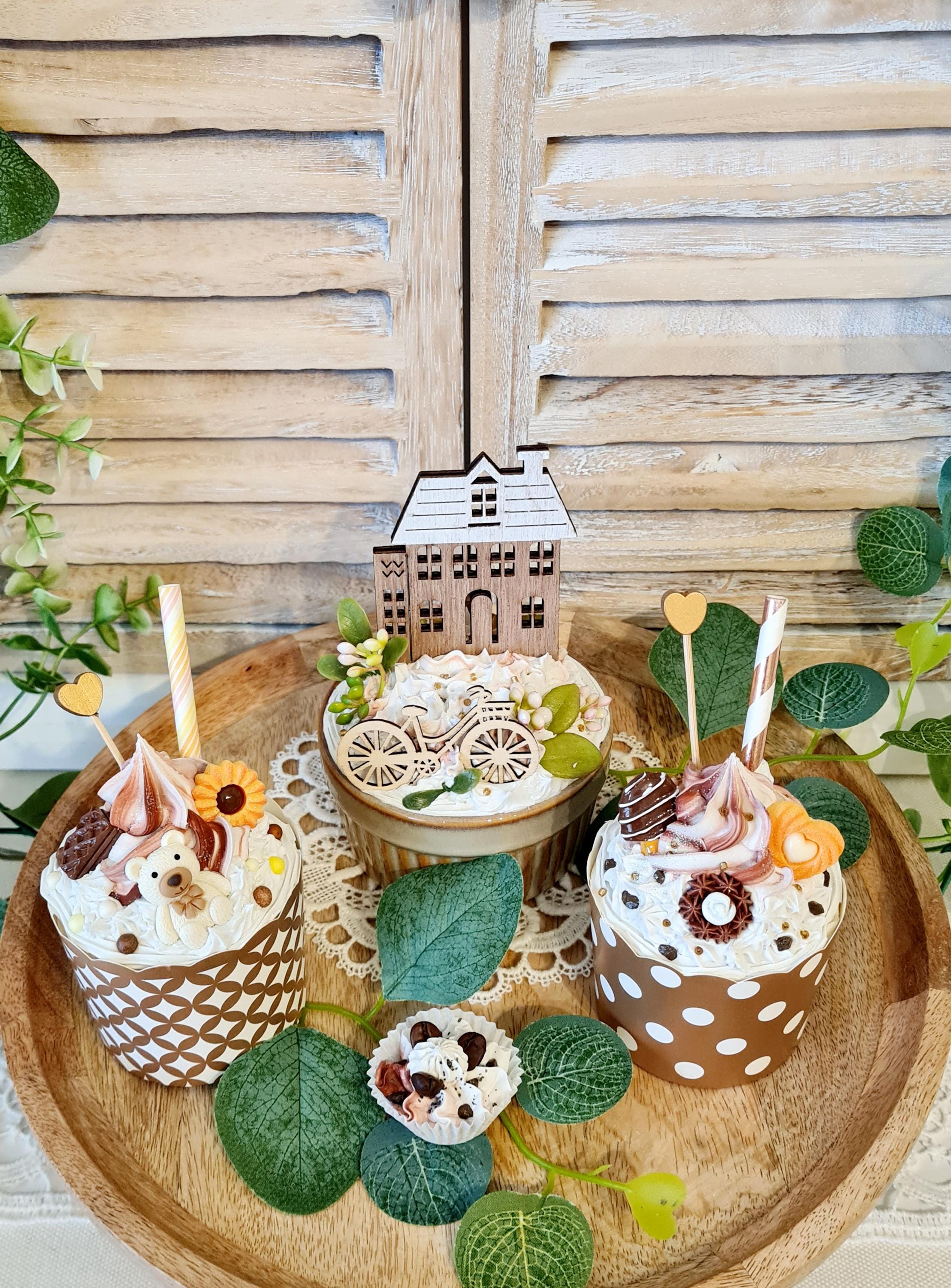 Decorative cupcakes and decorated bowls. Fake cake tarts. Decoration.
