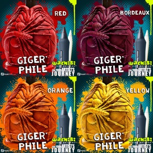 May include: Four stylized stylus holders in red, burgundy, orange, and yellow, each with a unique textured design. The text "GIGER PHILE" is displayed below each holder, with the "Wachibi" logo and "For Your Artists Journey" text.