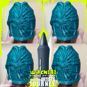 May include: Four teal stylus holders with an alien egg design. The holders are arranged around two styluses, one gray and one white. The text "WACHIBI STYLUS HOLDERS FOR YOUR ARTIST'S JOURNEY" is displayed in a yellow and white font.