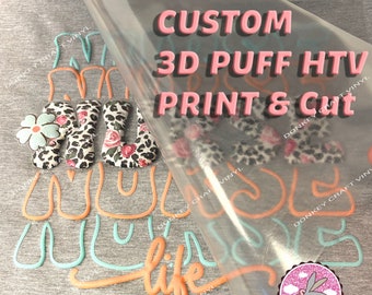 May include: A gray t-shirt with the words "MAMA" in a leopard print design and a flower accent. The words "MAMA" are in a 3D puff HTV print. The words "life" and "CUSTOM 3D PUFF HTV PRINT & Cut" are also visible.