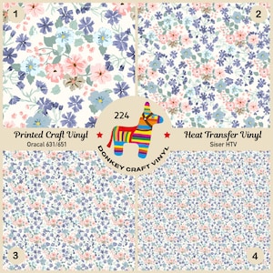 May include: Four floral pattern vinyl sheets. The patterns include various flowers in shades of pink, blue, and white. The image also includes text that reads "Printed Craft Vinyl" and "Heat Transfer Vinyl". A colorful donkey logo is in the center.