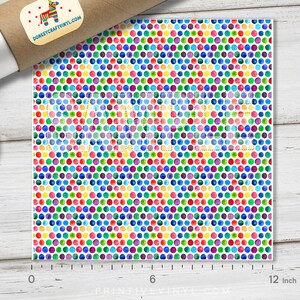 May include: A sheet of colorful vinyl with a repeating pattern of watercolor dots in various colors, including red, blue, green, and yellow. The sheet measures 12 inches wide. A roll of vinyl and a lid are in the background.
