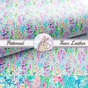 May include: A sheet of white faux leather with a colorful patterned design. The pattern features a variety of colors, including pink, blue, green, and yellow. The pattern is reminiscent of a floral design. The text "Patterned" and "Faux Leather" is visible on the image.
