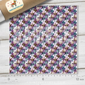 May include: A square sheet of patterned vinyl featuring a repeating floral design in shades of purple, teal, and brown on a white background. The sheet is approximately 12 inches wide. A roll of vinyl and a plate are in the image.
