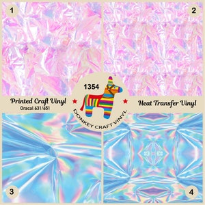 May include: Four samples of iridescent vinyl in pink and blue colors. The top two samples are labeled "Printed Craft Vinyl Oracal 631/651" and "Heat Transfer Vinyl". The bottom two samples are unlabeled. A donkey logo with the text "DONKEY CRAFT VINYL" is in the center of the image.