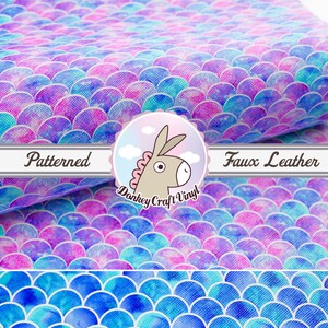 May include: A sheet of faux leather with a mermaid scale pattern in shades of blue, pink, and purple. The fabric is patterned and has a textured surface. The text "Patterned Faux Leather" is visible in the image.