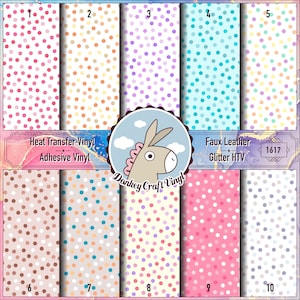 May include: Ten different polka dot patterned heat transfer vinyl and faux leather glitter HTV sheets. The sheets are white with various colored polka dots. The text "Heat Transfer Vinyl - Adhesive Vinyl" and "Faux Leather Glitter HTV" is on the top of the sheets. The text "Donkey Craft Vinyl" is in the center of the image.