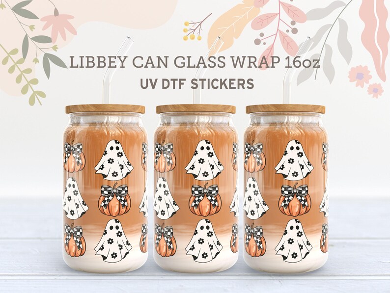 May include: Three 16oz glass can wraps with a Halloween theme. The wraps feature a white ghost with black eyes and a black bow, and a pumpkin with a black and white checkered bow. The wraps are designed for use with UV DTF stickers.