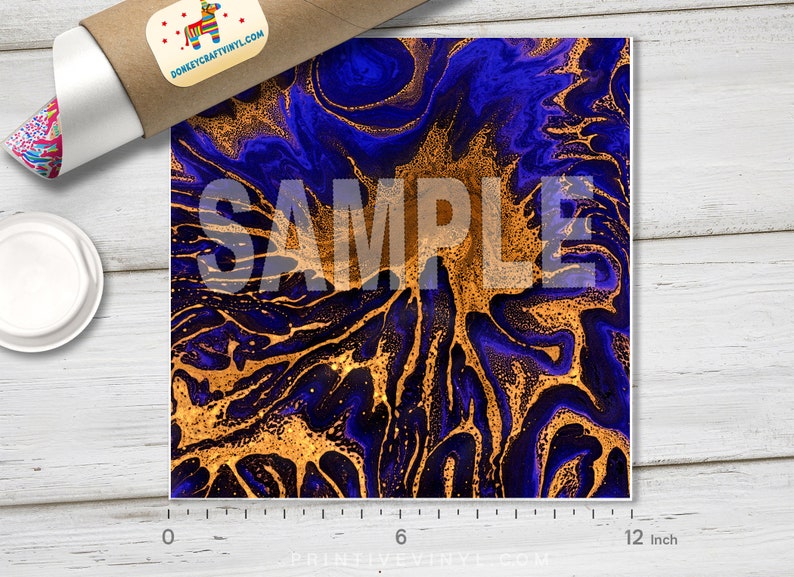 May include: A square print with a blue and gold abstract design. The design features swirling patterns with gold accents. The word "SAMPLE" is overlaid on the print. The print measures approximately 12 inches.