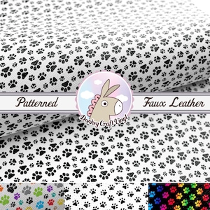 May include: White faux leather fabric with a black paw print pattern. The fabric is folded in half and the words "Patterned" and "Faux Leather" are visible on the fold. The fabric is also available in other colors, including rainbow, gray, and purple.