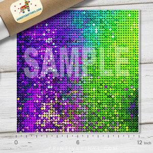 May include: A square sheet of vinyl with a vibrant, shimmering pattern. The design transitions from purple to green, with the word "SAMPLE" overlaid. The sheet measures approximately 12 inches wide.