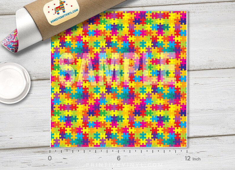 May include: A colorful puzzle piece pattern with a "SAMPLE" watermark. The pattern is made up of small, brightly colored puzzle pieces in shades of red, orange, yellow, green, blue, purple, and pink. The pattern is repeated throughout the image.