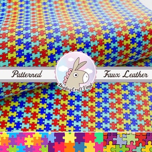 May include: A sheet of faux leather fabric with a patterned design of colorful puzzle pieces. The fabric is textured and has a subtle sheen. The text "Patterned Faux Leather" is visible in the image.