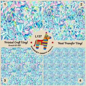 May include: Four squares of patterned vinyl, two labeled "Printed Craft Vinyl" and "Oracal 631/651" and two labeled "Heat Transfer Vinyl". A donkey with a rainbow pattern and the text "L137 DONKEY CRAFT VINYL" is in the center.