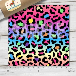 May include: A 12-inch square sheet of rainbow leopard print vinyl. The vinyl has a gradient of pink, orange, yellow, green, blue, and purple with black leopard spots.