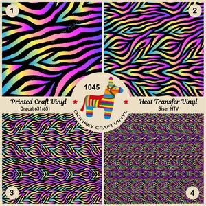 May include: Four sheets of rainbow zebra patterned vinyl, two sheets are printed craft vinyl and two sheets are heat transfer vinyl. The sheets are labeled with numbers 1 through 4. The text "Printed Craft Vinyl Oracal 631/651" and "Heat Transfer Vinyl Siser HTV" are printed on the sheets. The text "1045 Donkey Craft Vinyl" is printed in a circle with a donkey illustration.