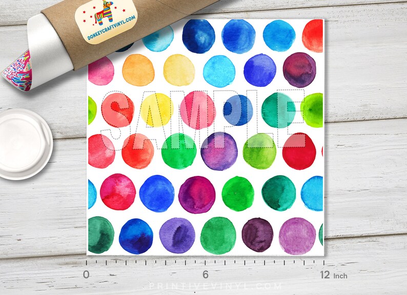 May include: A square print featuring a watercolor pattern of colorful polka dots in shades of red, orange, yellow, green, blue, and purple. The word "SAMPLE" is printed across the image. The print measures approximately 12 inches.