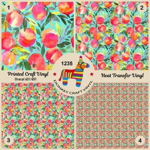 May include: Four different patterns of printed craft vinyl and heat transfer vinyl featuring a watercolour design of red apples on turquoise branches. The text "Printed Craft Vinyl" and "Oracal 631/651" are printed on the top left image. The text "Heat Transfer Vinyl" is printed on the top right image. The text "1235 DONKEY CRAFT VINYL" is printed in a colourful banner on the centre of the image.
