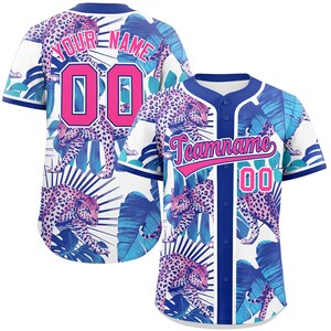 May include: Baseball jersey with a white background, featuring a vibrant design of pink leopards and blue tropical leaves. The jersey includes the text "YOUR NAME" and "Teamname" in pink, along with the number "00". The jersey has a blue collar and trim.