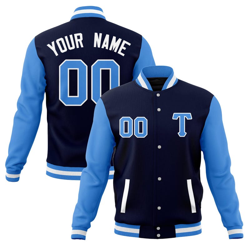 May include: A navy blue and light blue baseball jacket with white accents. The jacket has a button closure and two pockets. The back of the jacket has the text "YOUR NAME" and the number "00" in white. The front of the jacket has the number "00" and the letter "T" in white.