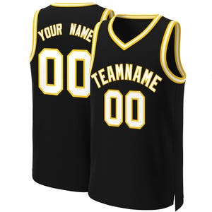 May include: Black basketball jersey with white and gold trim. The jersey has "YOUR NAME" and "TEAMNAME" with numbers on the front and back.