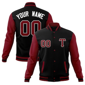 May include: Black and maroon varsity jacket with a white "YOUR NAME" and "00" on the back and a white "00" and "T" on the front.