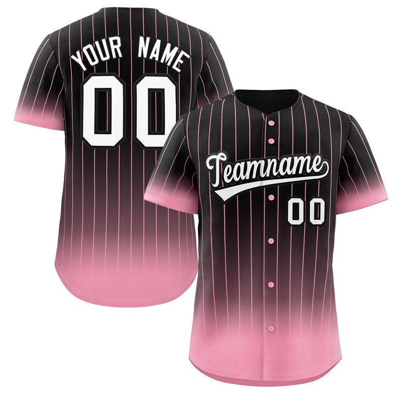 May include: Black and pink baseball jersey with white pinstripes. The jersey has a gradient fade from black to pink. The back of the jersey has "YOUR NAME" and "00" in white. The front of the jersey has "Teamname" in a white cursive font and "00" in white.