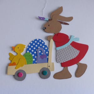 Fensterbild, Tonkarton, Hasenfrau mit Osterwagen