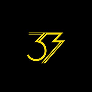 May include: A graphic design featuring the number 33 rendered in a bright yellow, double-lined font against a solid black background. The design incorporates a sharp, angular lightning bolt shape integrated into the right side of the number three.