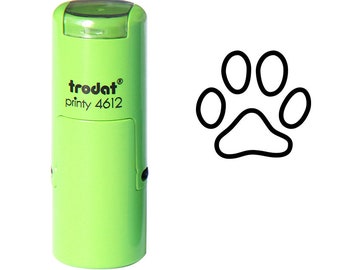 Puede incluir: Sellos de tinta automática verde con el texto "trodat printy 4612" y un contorno negro de una huella de pata.