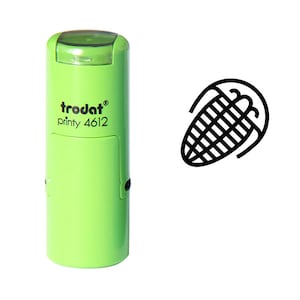 May include: Green self-inking stamp with the text "trodat printy 4612" and a black line drawing of an ear of corn.