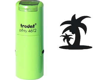 May include: Green self-inking stamp with the text "trodat printy 4612" and a black silhouette of two palm trees on a small island.