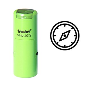 May include: Green self-inking stamp with the text "trodat printy 4612" and a black and white compass icon.