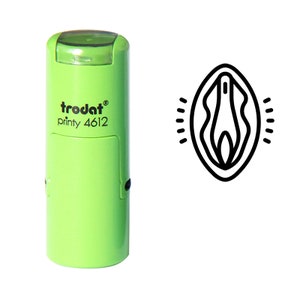 May include: A green self-inking stamp with the text "trodat printy 4612" and a black line drawing of a female reproductive organ.