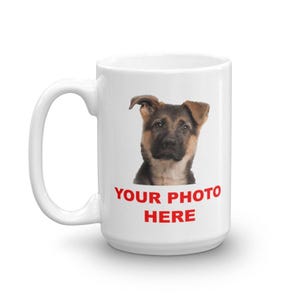 A white ceramic mug with a printed image of a German shepherd dog on it, along with the text "YOUR PHOTO HERE" printed below the dog.