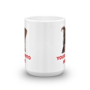 A white ceramic mug with a printed image of a dog on it, along with the text "YOUR DOG HERE" printed on it.
