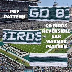 May include: A crochet ear warmer pattern featuring dark green and white yarn. The text reads PDF PATTERN and GO BIRDS REVERSIBLE EAR WARMER PATTERN. The design includes the words GO BIRDS in block letters and a striped pattern on the reverse side.