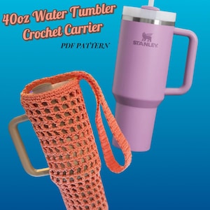 May include: A light purple 40oz Stanley water tumbler with a white lid and straw, next to an orange crochet carrier. The carrier has a handle and is designed to hold the tumbler. Text on the image reads "40oz Water Tumbler Crochet Carrier PDF Pattern."