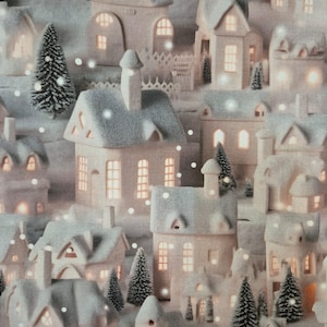 May include: A winter village scene with miniature houses and evergreen trees. The houses are white with gray snowy roofs and lit windows. Snowflakes are scattered throughout the scene, creating a cozy, festive atmosphere.