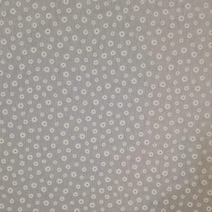 May include: A close-up of a light grey fabric with a repeating pattern of small white daisies.