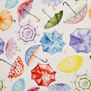 Può includere: Uno schema di ombrelli colorati con vari disegni, tra cui pois, strisce e motivi floreali. Gli ombrelli sono dipinti in stile acquerello su uno sfondo bianco.