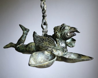 Garuda statue, temple oil lamp