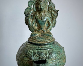 Vishnu statue, temple oil lamp