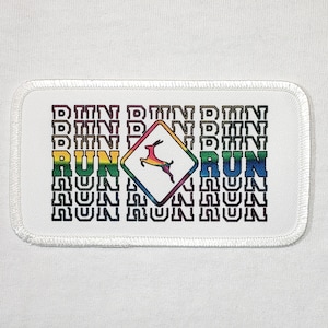 May include: White patch with a rainbow colored road sign with a deer inside and the word "RUN" on either side. The words "RUN" are repeated in black text above and below the sign.