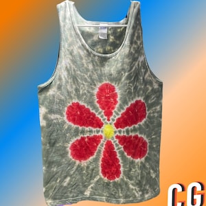 May include: A green tank top with a tie-dye pattern and a red flower design. The flower has a yellow center.