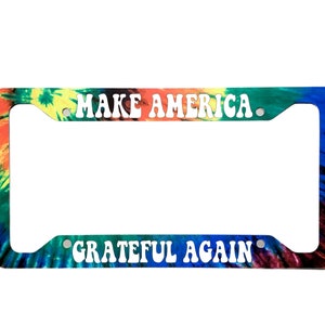 May include: A tie-dye license plate frame with the text "Make America Grateful Again".