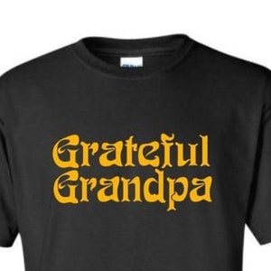 May include: Black t-shirt with the text "Grateful Grandpa" in yellow.