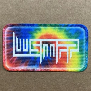May include: A tie-dye fabric patch with the word "WSPNPR" in white lettering.