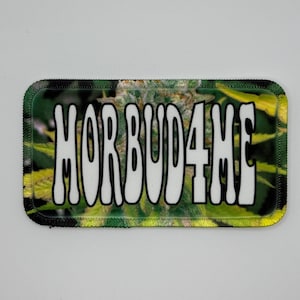 May include: A green and yellow patch with the text "MOR BUD4ME" in white letters.