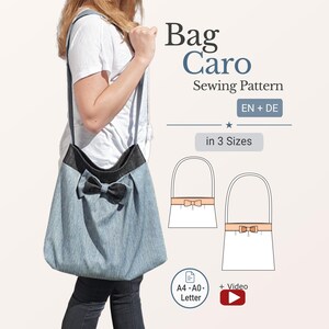 May include: A light blue denim tote bag with a black bow and strap, held by a person. The bag has a black top and is part of a sewing pattern labeled "Bag Caro" with "EN + DE" and "in 3 Sizes". Includes A4-A0-Letter and video icons.